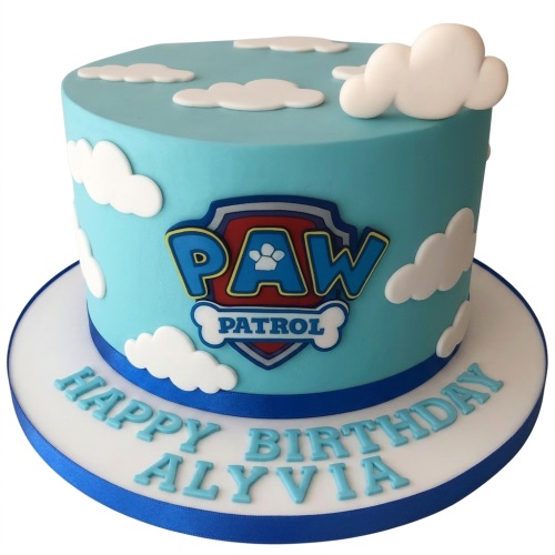Round light blue Paw Patrol birthday cake with white clouds and personalised message.