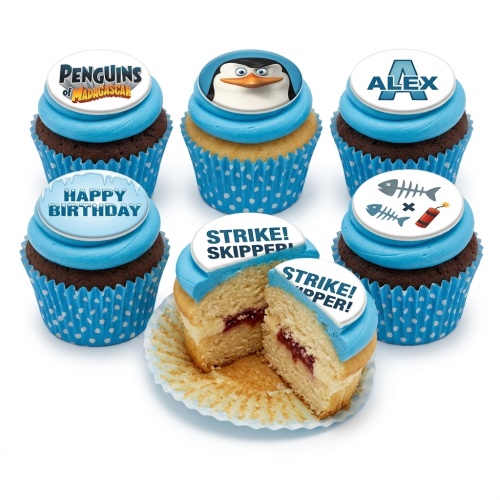 Penguins of Madagascar themed cupcakes with blue frosting, character toppers, and custom messages.