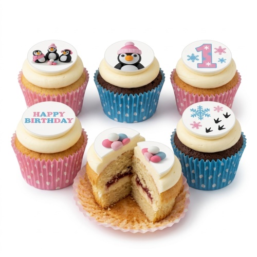 Assortment of penguin and snowflake themed birthday cupcakes with 'Happy Birthday' message and custom age topper.