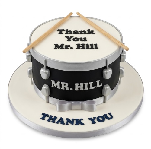Single-tier drum shaped cake with black and silver fondant, drumsticks, and a custom message.