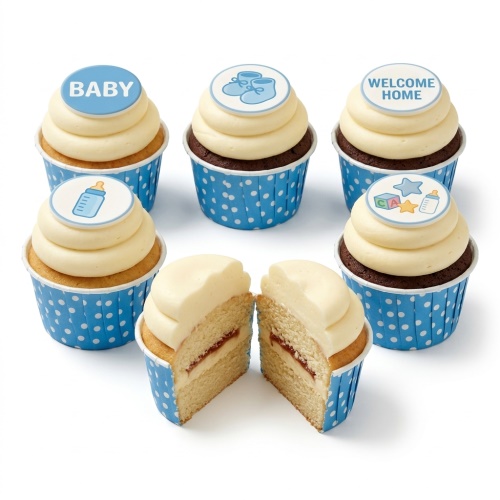Blue baby shower cupcakes with baby booties, bottle, and 'BABY' toppers.