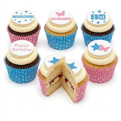 Kids birthday cupcakes with blue and pink cases, topped with white frosting and edible star and butterfly decorations, featuring custom name and age toppers.