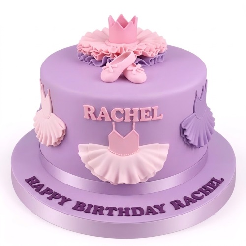 Lavender ballerina birthday cake with pink ballet shoes, crown, and tutus, suitable for a girl's celebration.