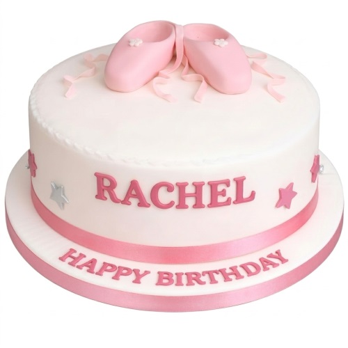 White round birthday cake with pink ballet shoes, pink ribbon, and silver and pink stars.