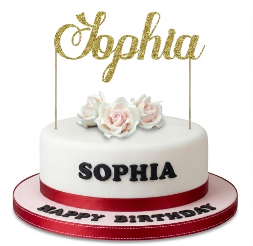 White single-tier birthday cake with pink sugar roses, red ribbon, and gold glitter name topper.