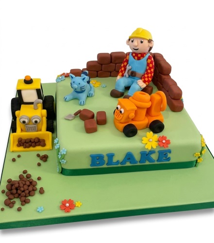 Green square Bob the Builder themed birthday cake with edible figurines of Bob, a cat, a digger, and a truck, with a personalised name.