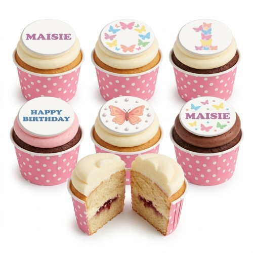 A selection of butterfly themed birthday cupcakes in pink polka dot wrappers with custom name and age toppers.