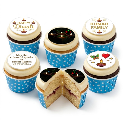 Diwali cupcakes with white frosting, blue polka dot wrappers, and festive edible toppers.