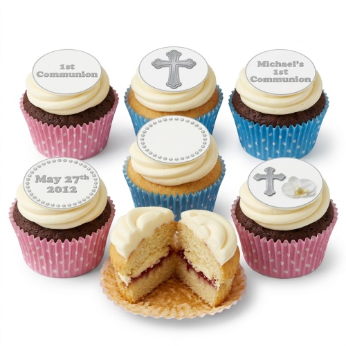 First Communion cupcakes with cross and custom message toppers in pink and blue wrappers.