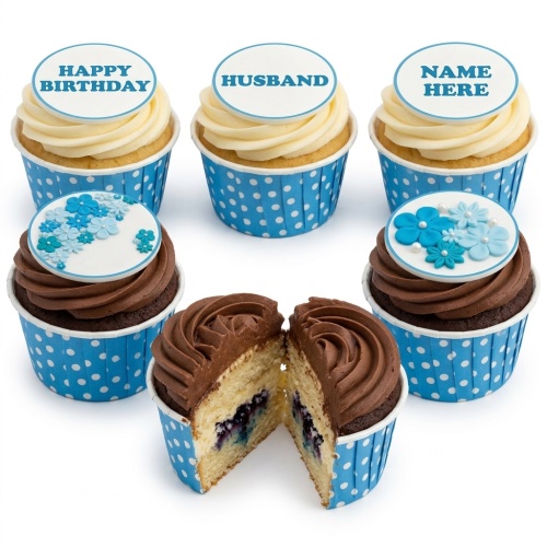 Six cupcakes in blue polka dot wrappers, three with text toppers and three with blue floral decorations and pearls.