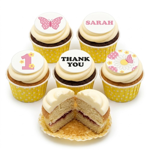Butterfly and floral cupcakes with custom age, name, and thank you toppers in yellow wrappers.