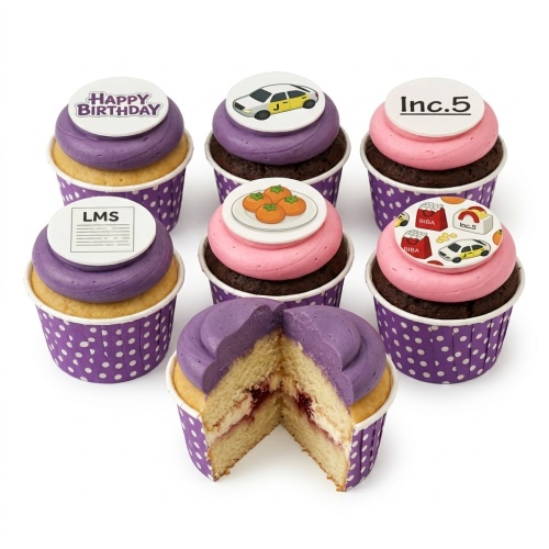 Six cupcakes with purple and pink frosting, featuring edible disc toppers with custom logos, a yellow car, and 'Happy Birthday' text.