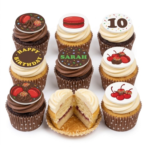 Assortment of birthday cupcakes with chocolate and vanilla frosting, topped with red macarons, cherries, and custom message discs.