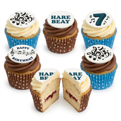 Six cupcakes with vanilla and chocolate frosting, topped with white fondant discs featuring black musical notes, 'Happy Birthday' text, and a blue number 7.