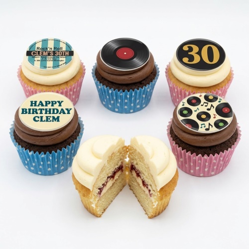 Six rock and roll themed cupcakes with vinyl record toppers and custom age and message examples.