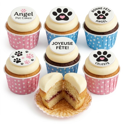 Six cupcakes with white frosting and paw print toppers in pink and blue polka dot cases, one cut open to show jam filling.