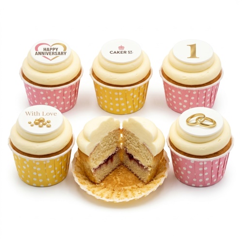 Anniversary cupcakes with white frosting, gold ring toppers, 'Happy Anniversary' and 'With Love' messages, and a custom number '1' topper.