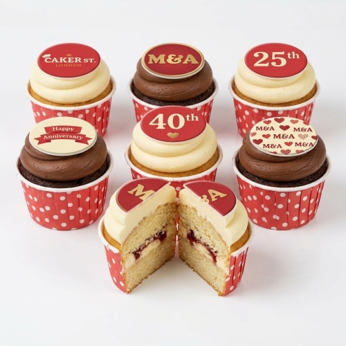 Cupcakes with red and gold anniversary toppers, some showing 'M&A', 'Happy Anniversary', '25th', and '40th'.