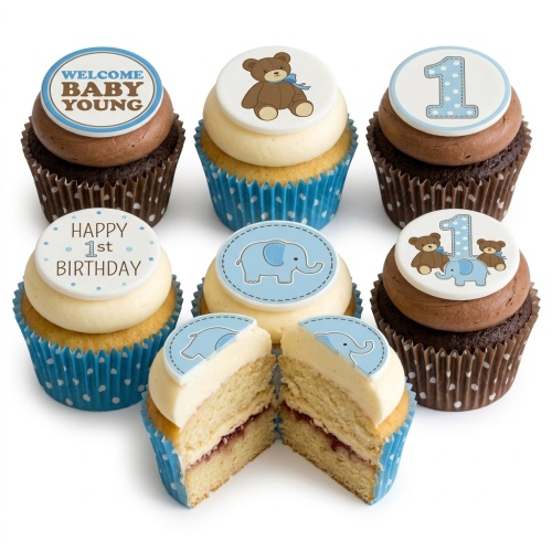 Assortment of baby boy 1st birthday cupcakes with teddy bear, elephant, and number one toppers.