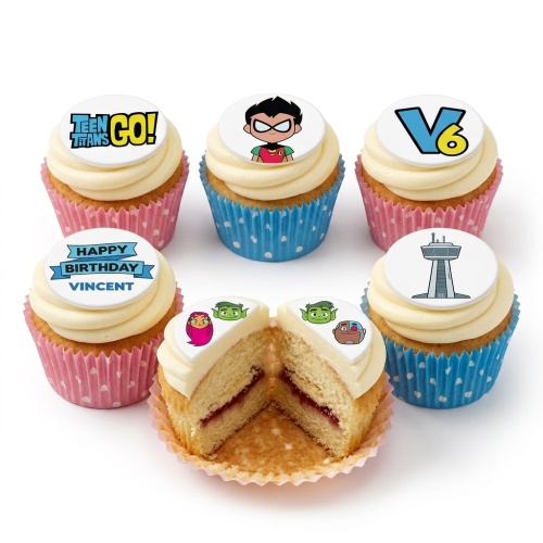 Vanilla cupcakes with Teen Titans Go! character and logo edible toppers, in pink and blue wrappers.