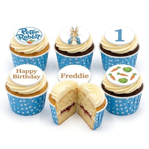 Peter Rabbit themed cupcakes with '1' age topper, "Happy Birthday" and "Freddie" message examples, carrots, and cabbages.