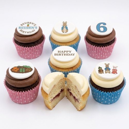Peter Rabbit themed birthday cupcakes with character toppers, garden scene, and custom age and name examples.