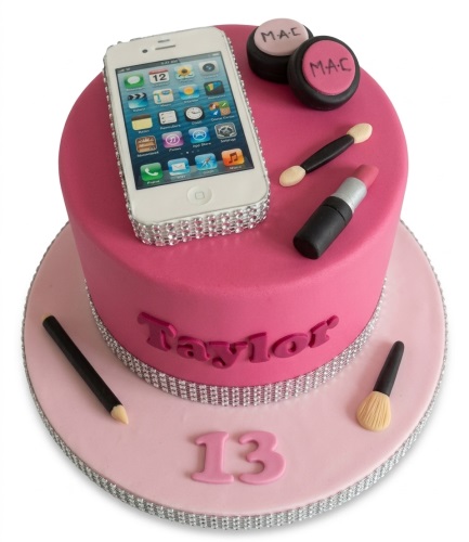 Two-tier pink fashion theme birthday cake with edible iPhone, makeup, and custom age 13