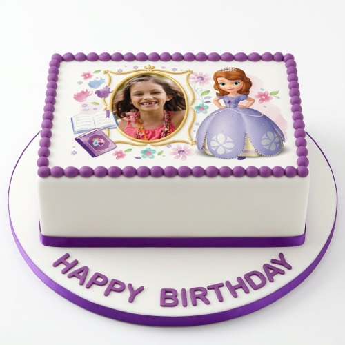 Rectangular white cake with Sofia the First, a photo frame with a child's picture, books, and purple 'Happy Birthday' text.