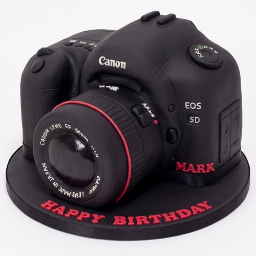 Black DSLR camera birthday cake with red accents and a custom message.