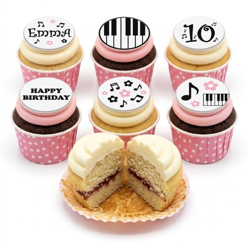 A set of musical notes and piano keyboard themed birthday cupcakes with pink and white frosting.
