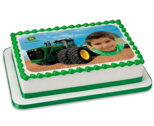 Rectangular white cake with green trim, featuring an edible image of a John Deere tractor and a child's photo.