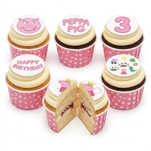 Peppa Pig themed birthday cupcakes with 'Happy Birthday' and custom age toppers, in pink polka dot wrappers.