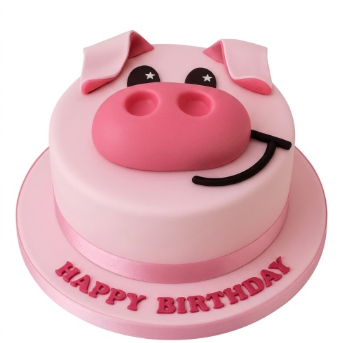 Pink pig face birthday cake with snout, ears, eyes, and a 'Happy Birthday' message.
