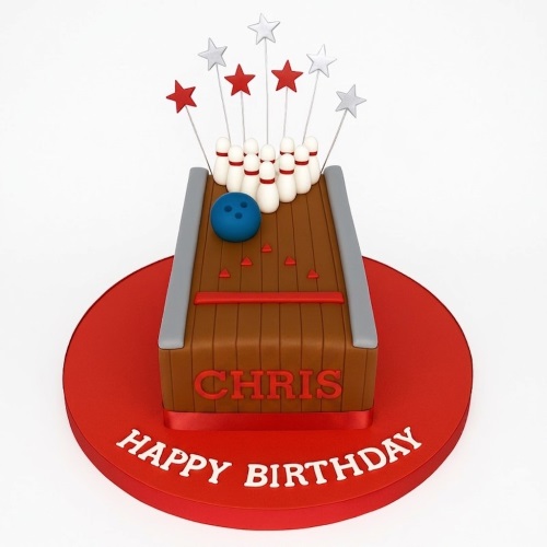 Rectangular bowling alley cake with pins, blue ball, and star toppers on a red board.