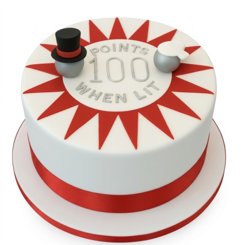 White round cake with red starburst design, silver pinball elements, and 'POINTS 100 WHEN LIT' text.