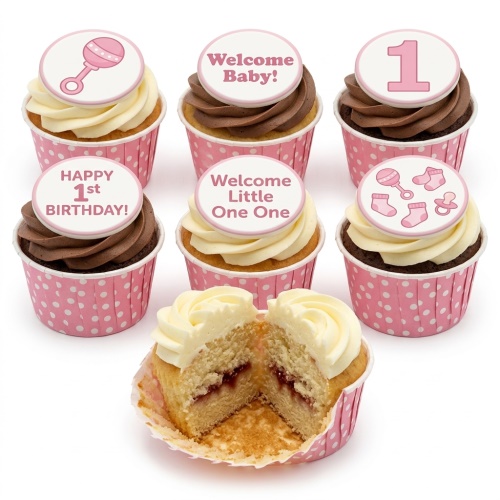 Pink cupcakes with vanilla and chocolate frosting, topped with edible baby rattles, socks, pacifiers, and messages like "Welcome Baby!" and "Happy 1st Birthday!".