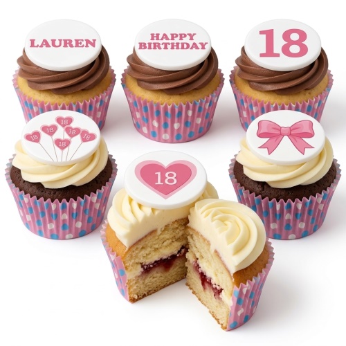 Pink and white birthday cupcakes with custom age toppers, hearts, and a bow design.