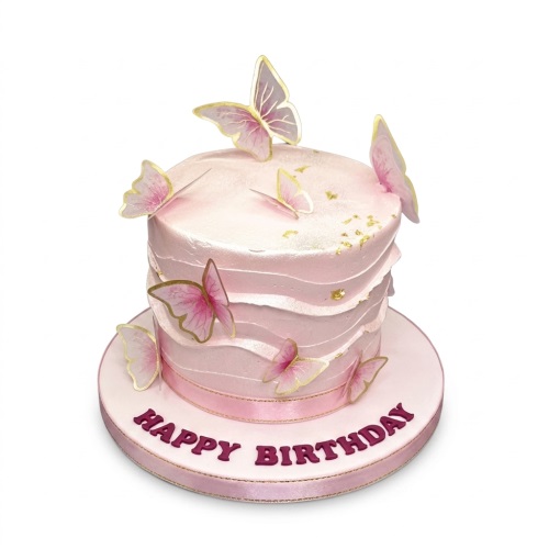 Pink birthday cake with textured buttercream, edible pink and gold butterflies, and gold leaf accents.