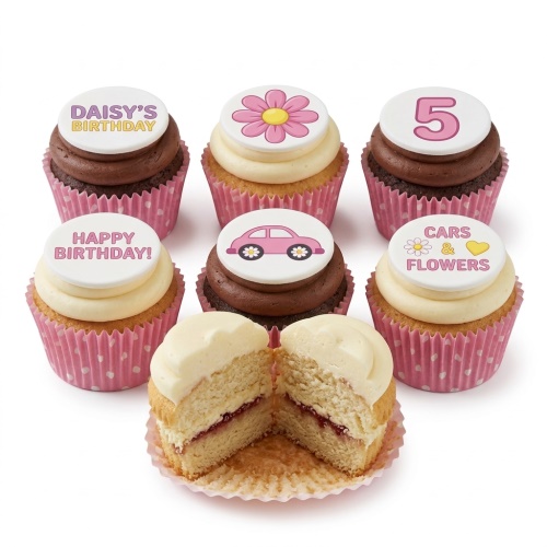 Pink and white cupcakes with edible toppers featuring cars, flowers, "Happy Birthday", and a custom age topper.