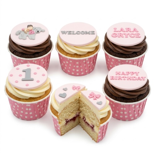 Pink cupcakes with baby elephant, bow, heart, and custom age '1' toppers.