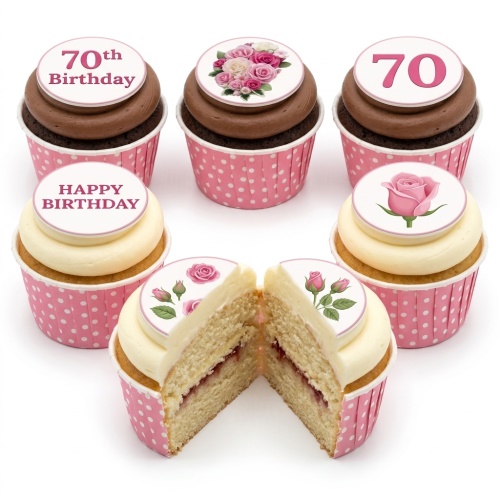 Assortment of floral rose birthday cupcakes with custom age and "Happy Birthday" toppers in pink polka dot cases.