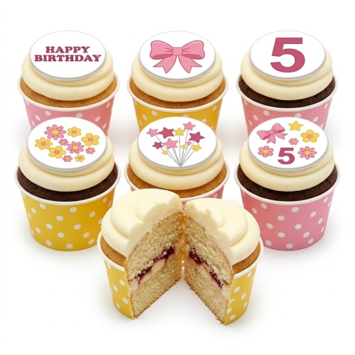 Kids birthday cupcakes with white frosting, pink and yellow polka dot cases, decorated with bows, flowers, stars, and a custom age topper.
