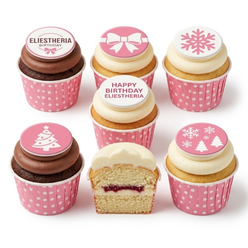 Pink round cupcakes decorated as a gift box with a white bow, snowflakes, and Christmas trees.