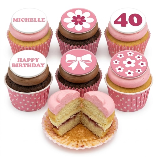 Assortment of pink and chocolate cupcakes with floral, bow, custom age, and personalised name toppers.