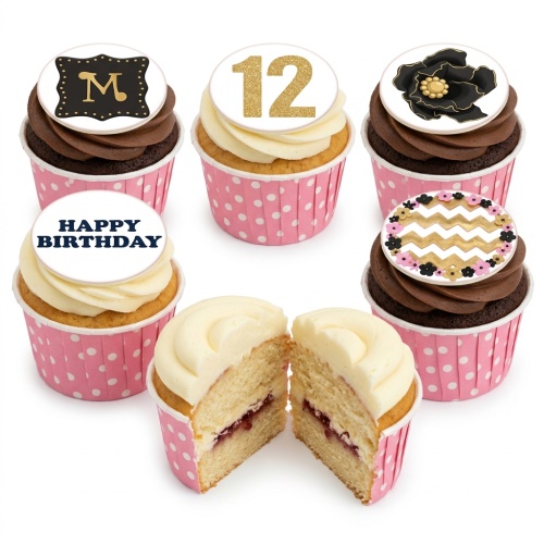 A selection of cupcakes with pink polka dot wrappers, featuring floral, chevron, initial, and custom age toppers.