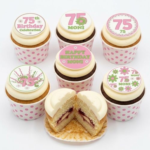 Floral birthday cupcakes with pink and green toppers and custom age.