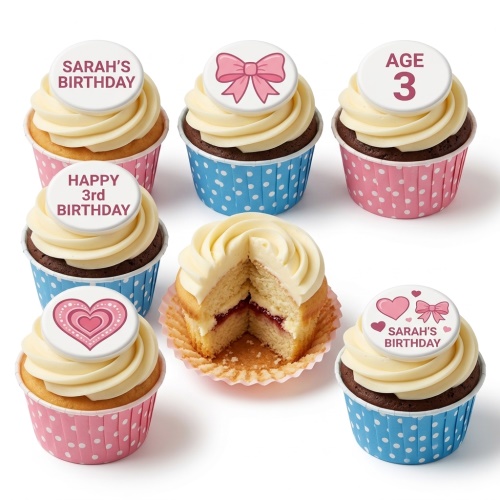 Girls birthday cupcakes with pink bows, hearts, and custom age toppers in pink and blue wrappers.