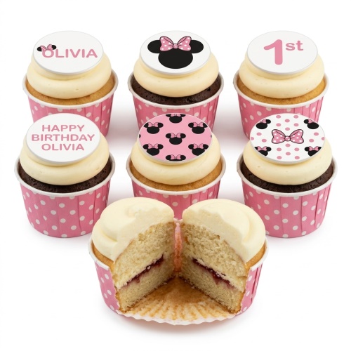 Minnie Mouse themed cupcakes with pink polka dot cases, featuring custom name and age toppers.