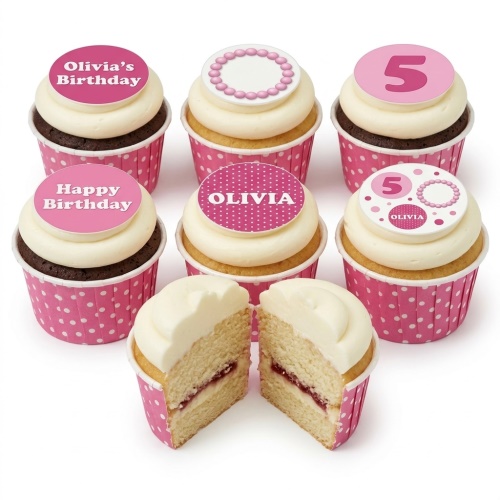 Pink and white polka dot birthday cupcakes with custom age and name toppers.