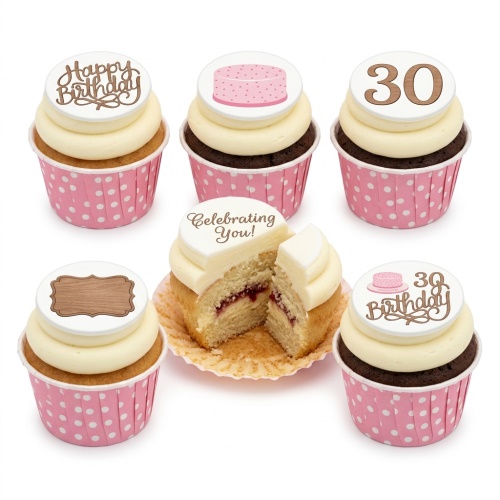 Adult birthday cupcakes with cream icing, pink polka dot wrappers, and customisable celebration toppers.